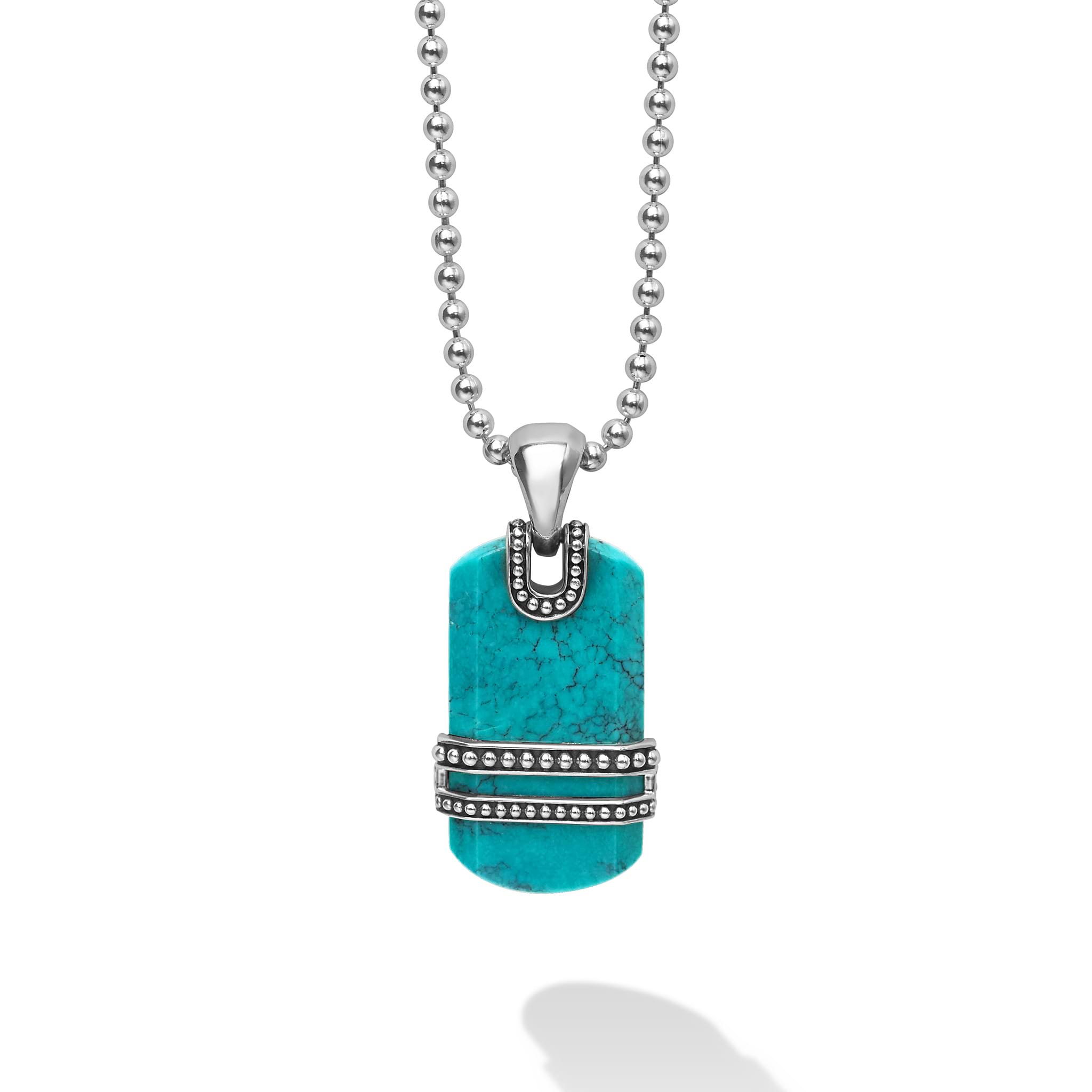 Black turquoise and sterling silver Caviar beading details form this tag amulet. Finished on a sterling silver ball chain necklace.