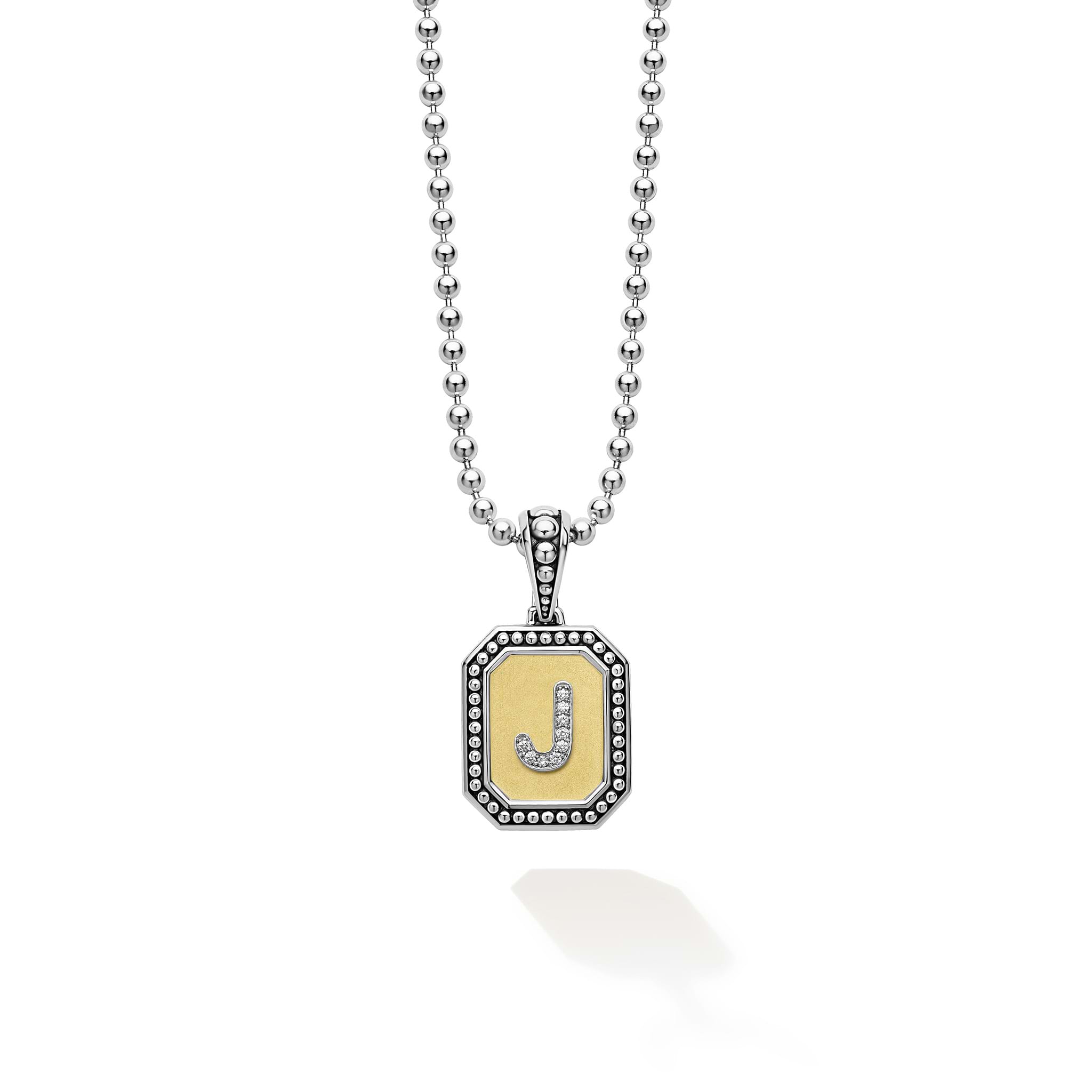 Our Signature Caviar sterling silver and 18K gold octagon initial 'J' charm accented with diamonds finished on a sterling silver ball chain necklace. LAGOS diamonds are the highest quality natural stones.
