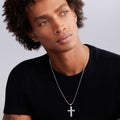 man wearing sterling silver cross amulet detailed with diamonds