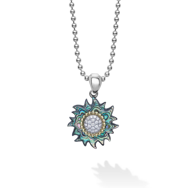 A LAGOS exclusive. This unique sun pendant necklace is crafted with abalone, diamonds, and 18K gold Caviar beading on a sterling silver chain. LAGOS diamonds are the highest quality natural stones.