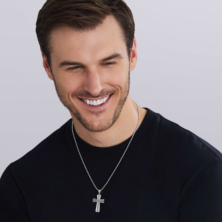 man weareing Caviar Beaded Cross Amulet in sterling silver