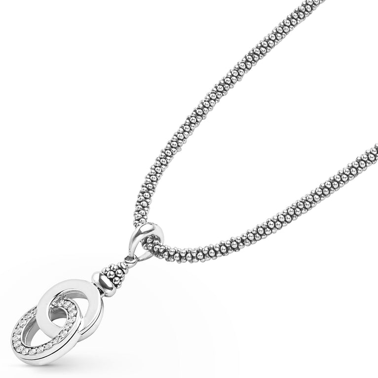 Signature Caviar Silver Interlocking Diamond Caviar Pendant Necklace featuring sterling silver beaded chain with intertwined rings, one pavé-set with diamonds, showcasing elegance and craftsmanship.