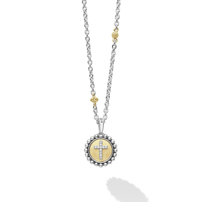 Signature Caviar Two-Tone Diamond Cross Charm Necklace featuring a silver chain, gold bead, and crystal-studded cross medallion, blending elegance with modern craftsmanship.