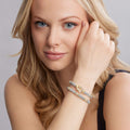 Woman wearing 18K Gold and Diamond Bracelet Gift Set