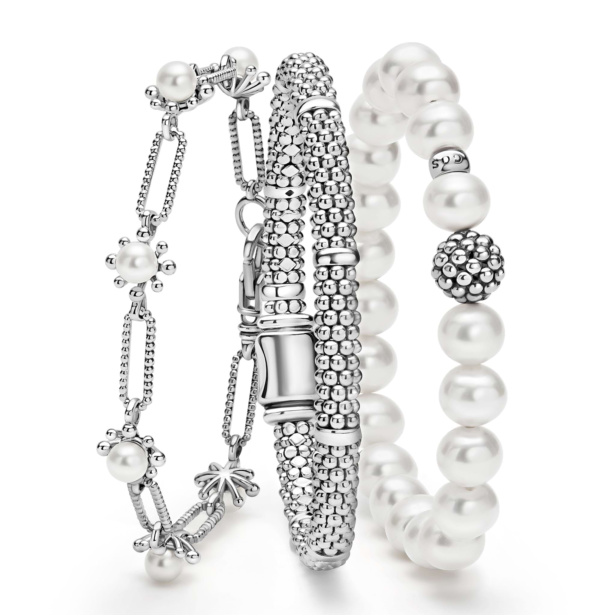 A LAGOS exclusive. Three classic bracelets to layer and make your own. One link bracelet made of Caviar sterling silver and fleur cultured freshwater pearls. One classic sterling silver station Caviar beaded bracelet. One pearl bracelet with a sterli