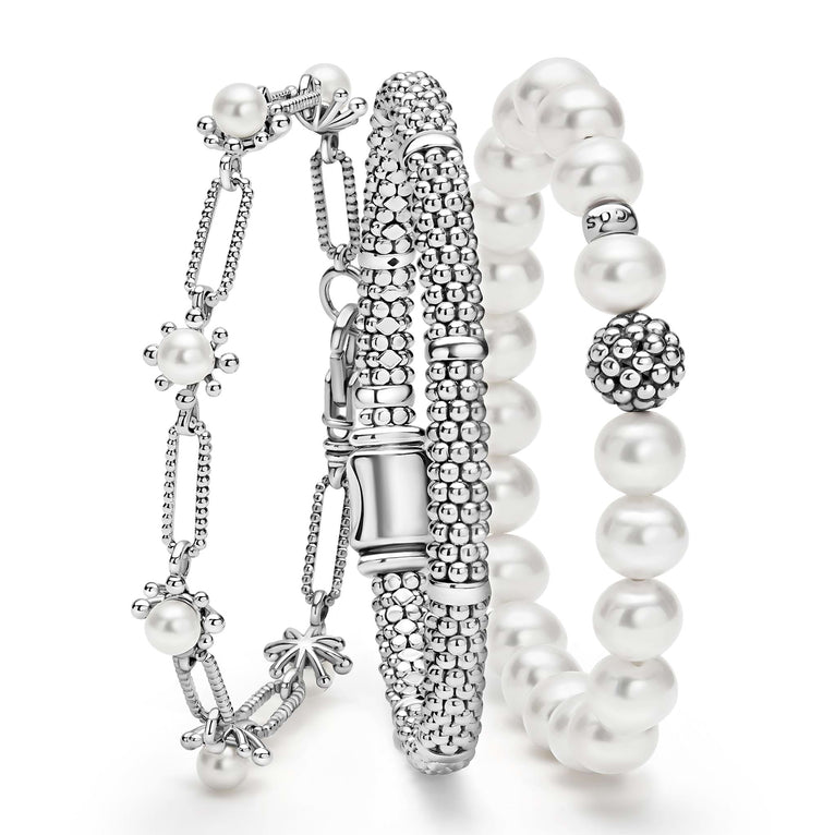 A LAGOS exclusive. Three classic bracelets to layer and make your own. One link bracelet made of Caviar sterling silver and fleur cultured freshwater pearls. One classic sterling silver station Caviar beaded bracelet. One pearl bracelet with a sterli