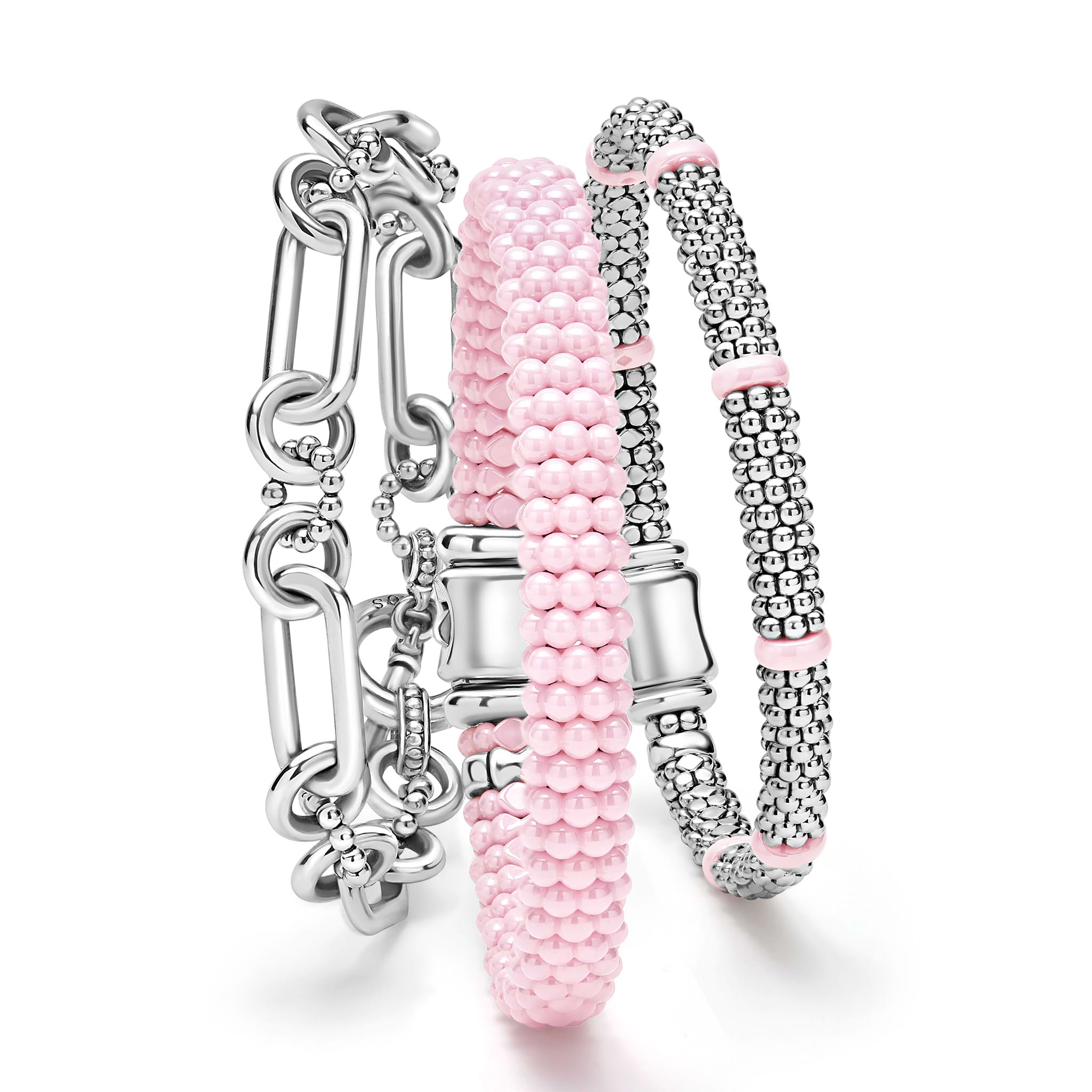 A LAGOS exclusive. Three classic bracelets to layer and make your own. One link bracelet made of sterling silver variations of Caviar beading & fluting elements. One pink ceramic Caviar beaded bracelet. One sterling silver Caviar beaded bracelet with