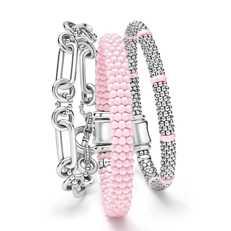 A LAGOS exclusive. Three classic bracelets to layer and make your own. One link bracelet made of sterling silver variations of Caviar beading & fluting elements. One pink ceramic Caviar beaded bracelet. One sterling silver Caviar beaded bracelet with
