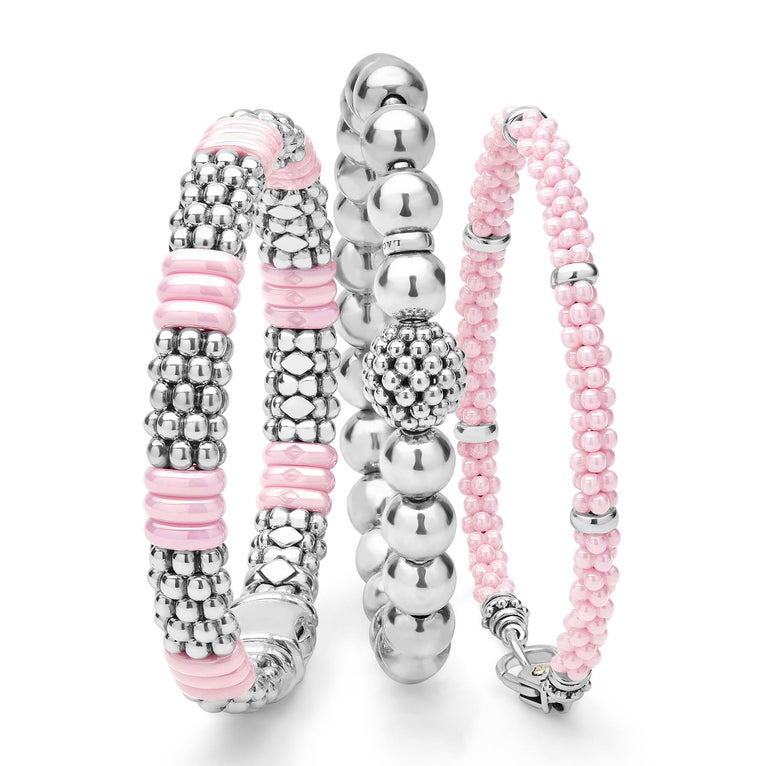 A LAGOS exclusive. Three classic bracelets to layer and make your own. One stretch bracelet made of smooth sterling silver. One pink ceramic Caviar beaded bracelet with sterling silver stations. One sterling silver Caviar beaded bracelet with a pop o