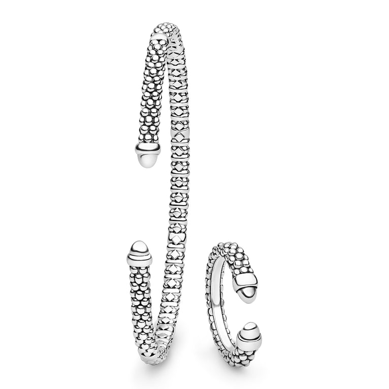 Silver bracelet and ring set on a white background