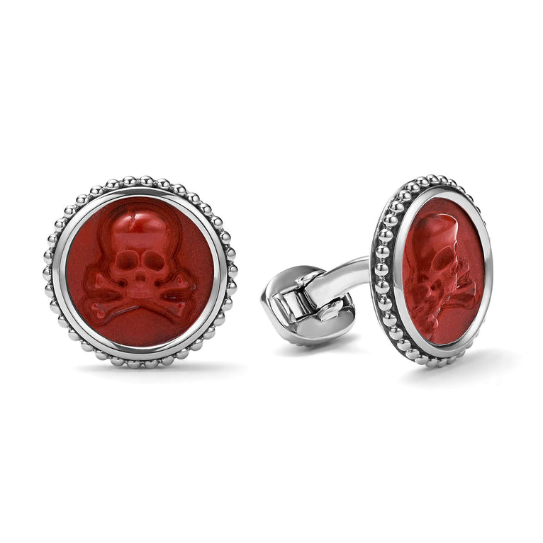 Red jasper gemstone accented by sterling silver Caviar beading forms these skull cuff links.