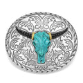 Intricately crafted turquoise gemstone and 18K gold surrounded by sterling silver form this bull motif belt buckle.