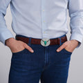 Model wearing Long Horn Belt Buckle featuring a polished turquoise gemstone with sterling silver Caviar beading