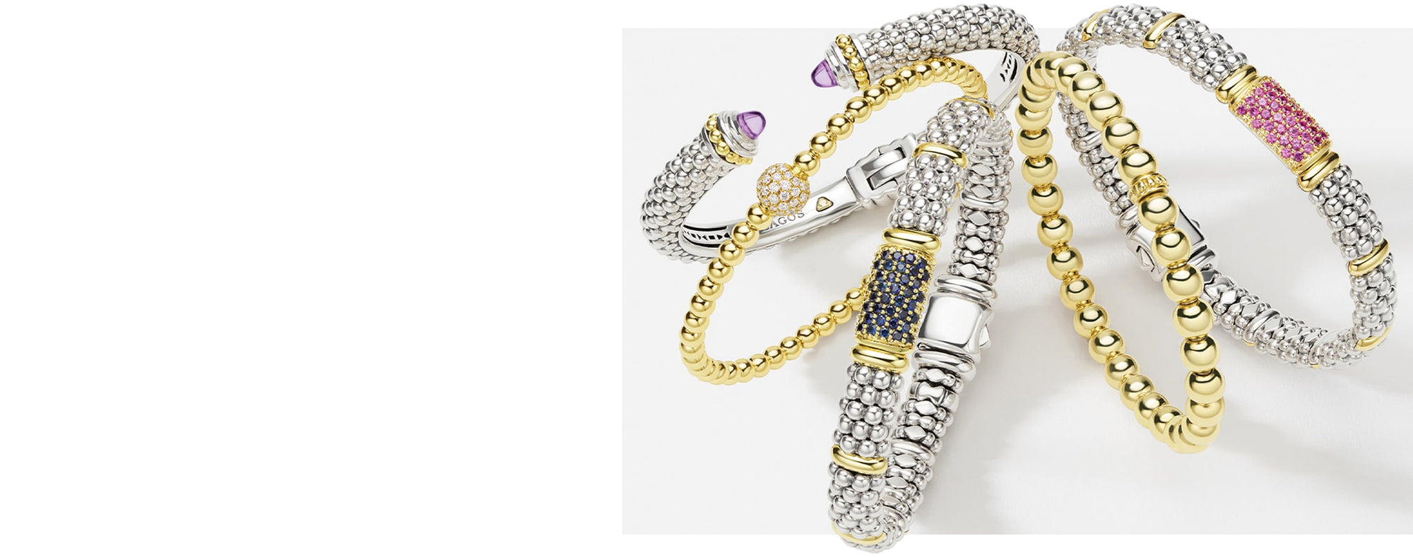 Gold and silver bracelet with purple accents on a white background