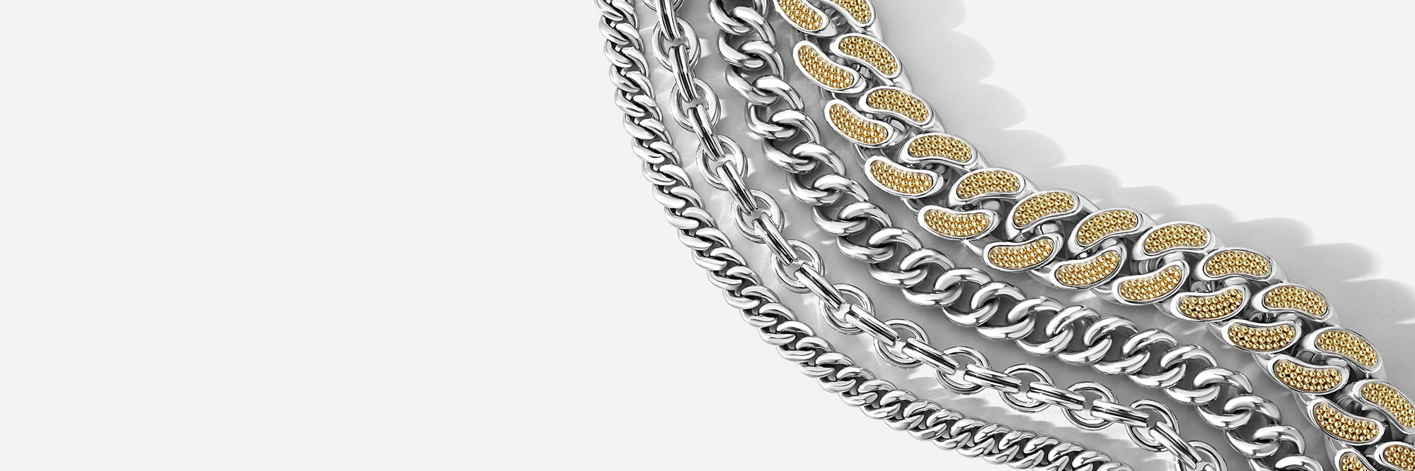 Close-up of multiple chain link bracelets in silver and gold arranged diagonally on a light gray background.