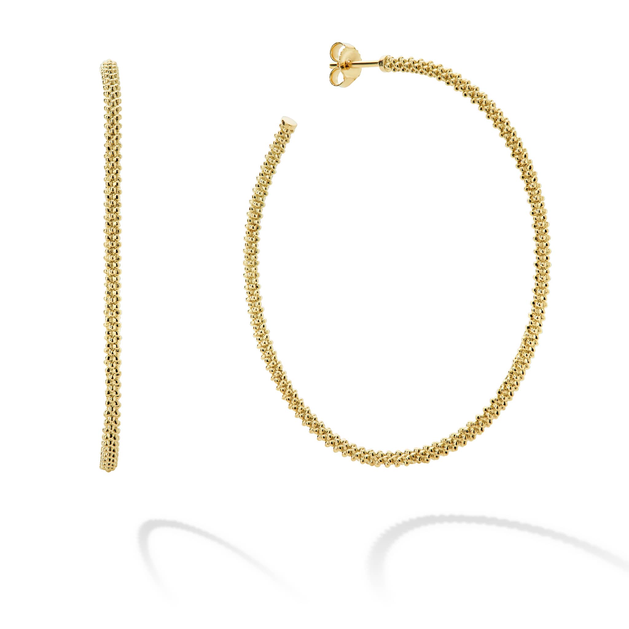Bold gold hoop earrings formed of 18k gold Caviar beading.