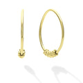 Smooth 18K gold accented with superfine Caviar beading form these timeless hoop earrings.