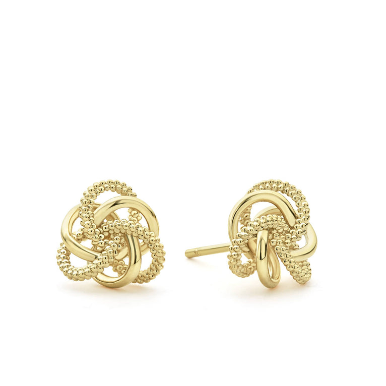 Love knot stud earrings formed of Caviar beaded and highly polished 18K gold bands.