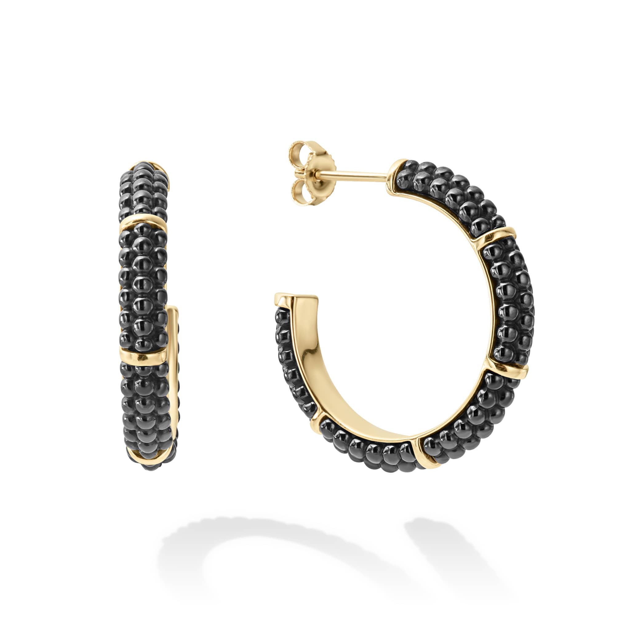Black ceramic beading highlighted by four 18K gold stations form these hoop earrings.