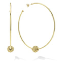 Statement 18K gold hoop earrings accented with a Caviar beaded ball.
