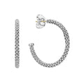 Signature sterling silver Caviar beads form these classic hoop earrings.