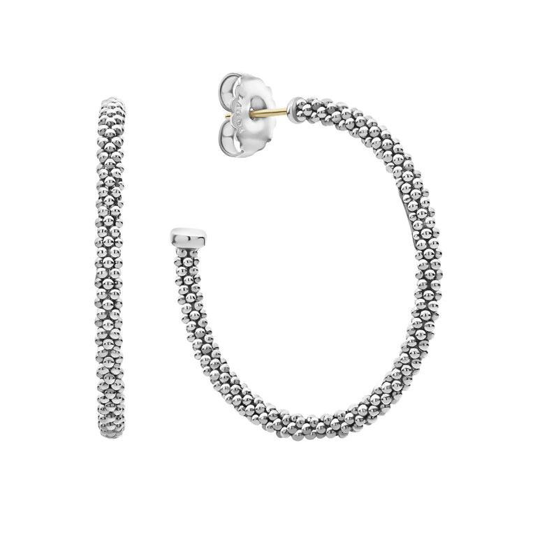 Signature sterling silver Caviar beads form these versatile hoop earrings.