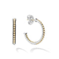 18K gold Caviar beading and sterling silver form these signature LAGOS hoop earrings.