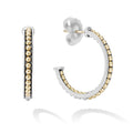 18K gold Caviar beading and sterling silver form these signature LAGOS hoop earrings.