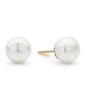 The ideal gift. Sophisticated cultured freshwater pearl earrings framed by flutes of sterling silver.