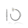 A diamond station accents this sterling silver Caviar beaded hoop earring. LAGOS diamonds are the highest quality natural stones.