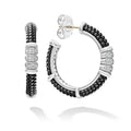 Diamonds, black ceramic beading, and sterling silver form these hoop earrings. LAGOS diamonds are the highest quality natural stones.
