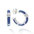Ultramarine ceramic Caviar beading, sterling silver and diamonds form these hoop earrings. LAGOS diamonds are the highest quality natural stones.