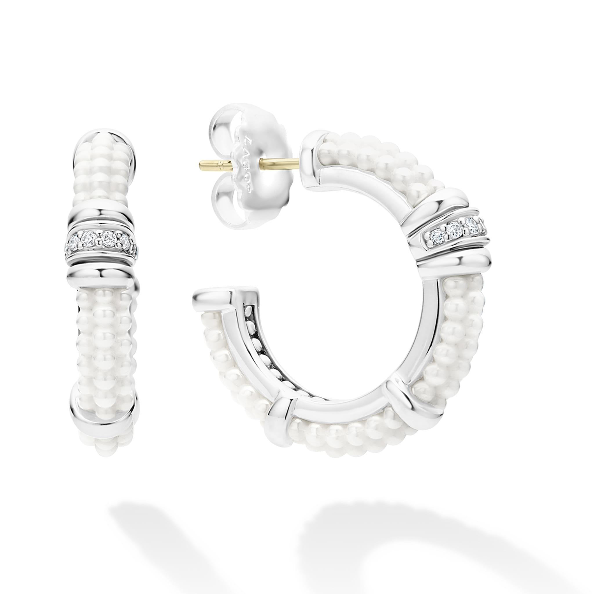 A LAGOS exclusive. White ceramic Caviar beading, sterling silver and diamonds form these hoop earrings. LAGOS diamonds are the highest quality natural stones.