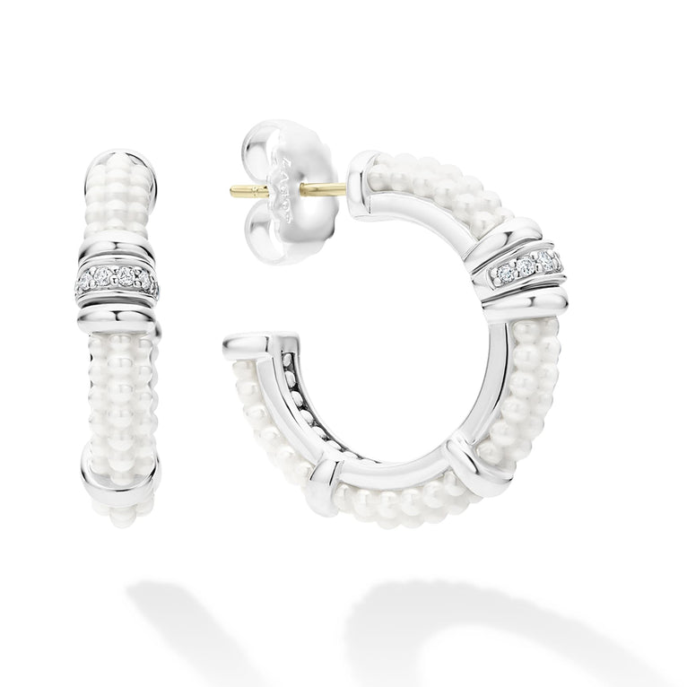 A LAGOS exclusive. White ceramic Caviar beading, sterling silver and diamonds form these hoop earrings. LAGOS diamonds are the highest quality natural stones.