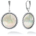 Mother of pearl gemstone circle drop earrings surrounded by sterling silver Caviar beading.