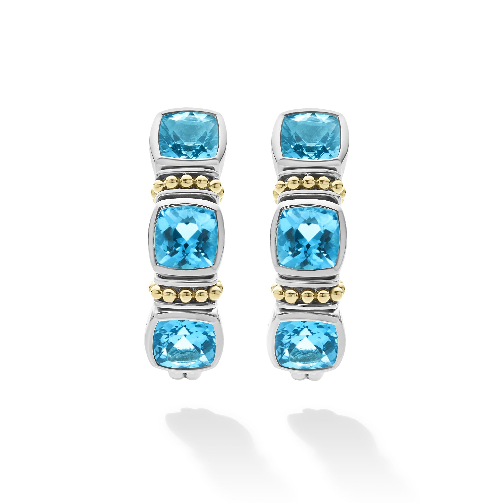 Rittenhouse Swiss Blue Topaz Hoop Earrings featuring three cushion-cut stones in sterling silver with 18K gold Caviar beading, exemplifying LAGOS' elegance and craftsmanship.