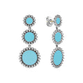 Blue ceramic circle drop earrings surrounded by sterling silver Caviar beading.