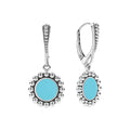 Blue ceramic circle drop earrings framed by sterling silver Caviar beading and finished with a lever back closure.