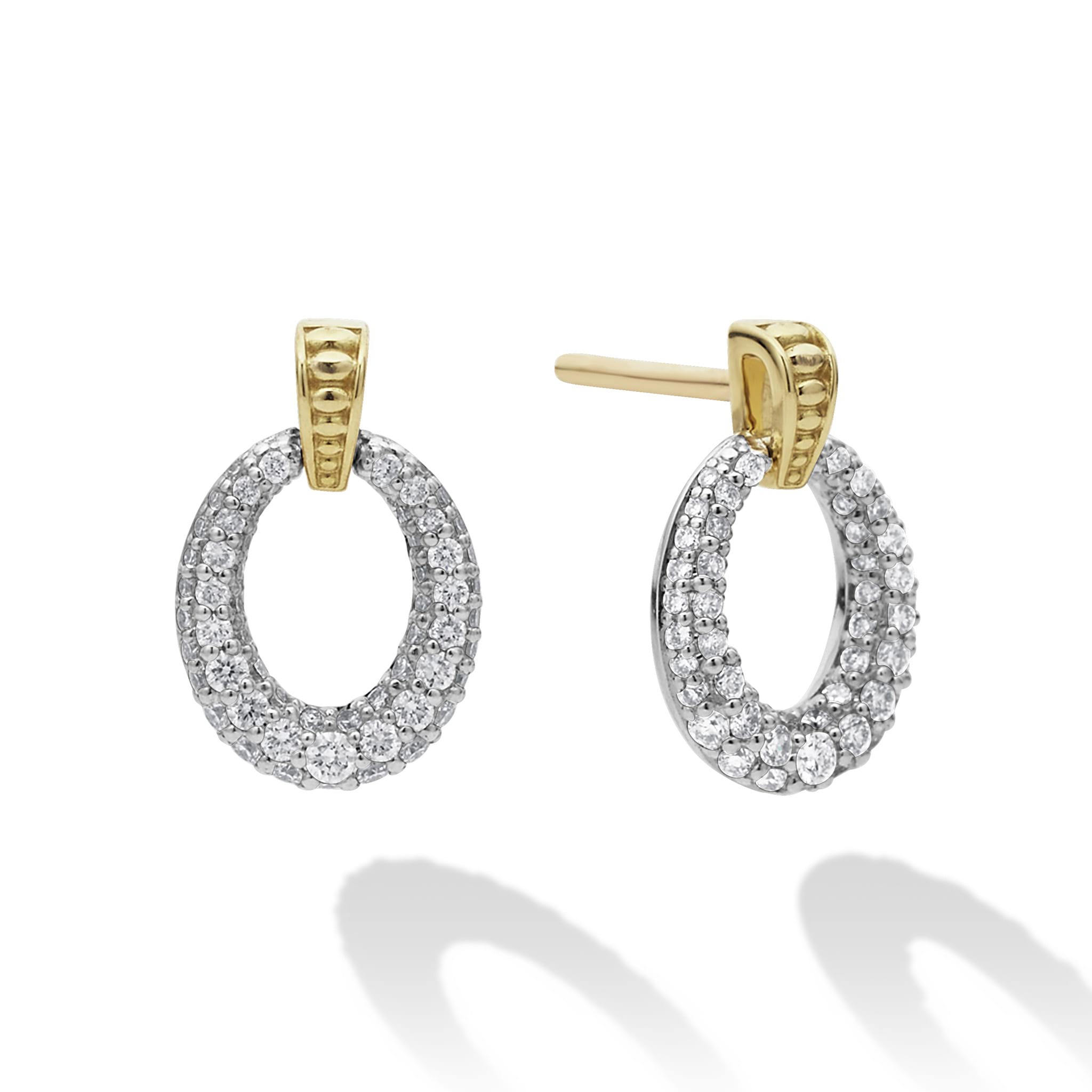 Oval drop diamond earrings highlighted by 18k gold Caviar beading. LAGOS diamonds are the highest quality natural stones.