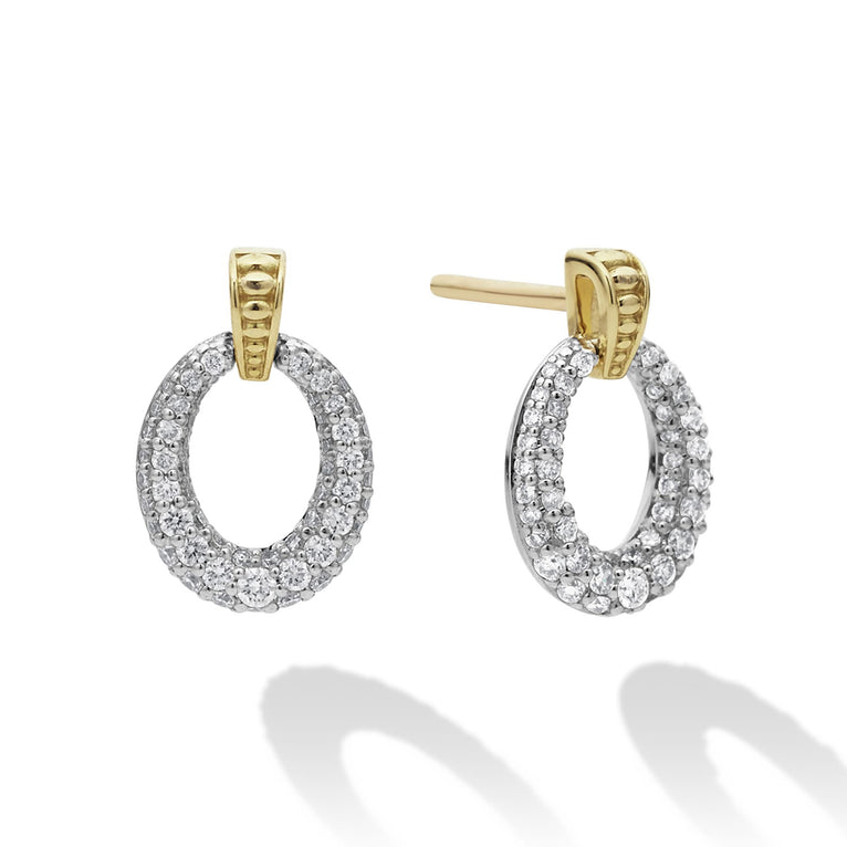 Oval drop diamond earrings highlighted by 18k gold Caviar beading. LAGOS diamonds are the highest quality natural stones.