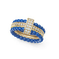 Three stacking rings form this set with two ceramic beaded bands and one diamond and 18K gold center band ring. Five sets of ceramic bands are included - Black, White, Blue, Dark Blue, Pink - to mix and match.