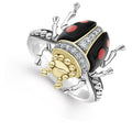 A LAGOS exclusive. Onyx with diamond, 18K gold and sterling silver accents forming a beetle ring. Ideal to pair with other signature Rare Wonder designs.Additional sizes may be available. Please contact customercare@lagos.com or call 877-925-4305.