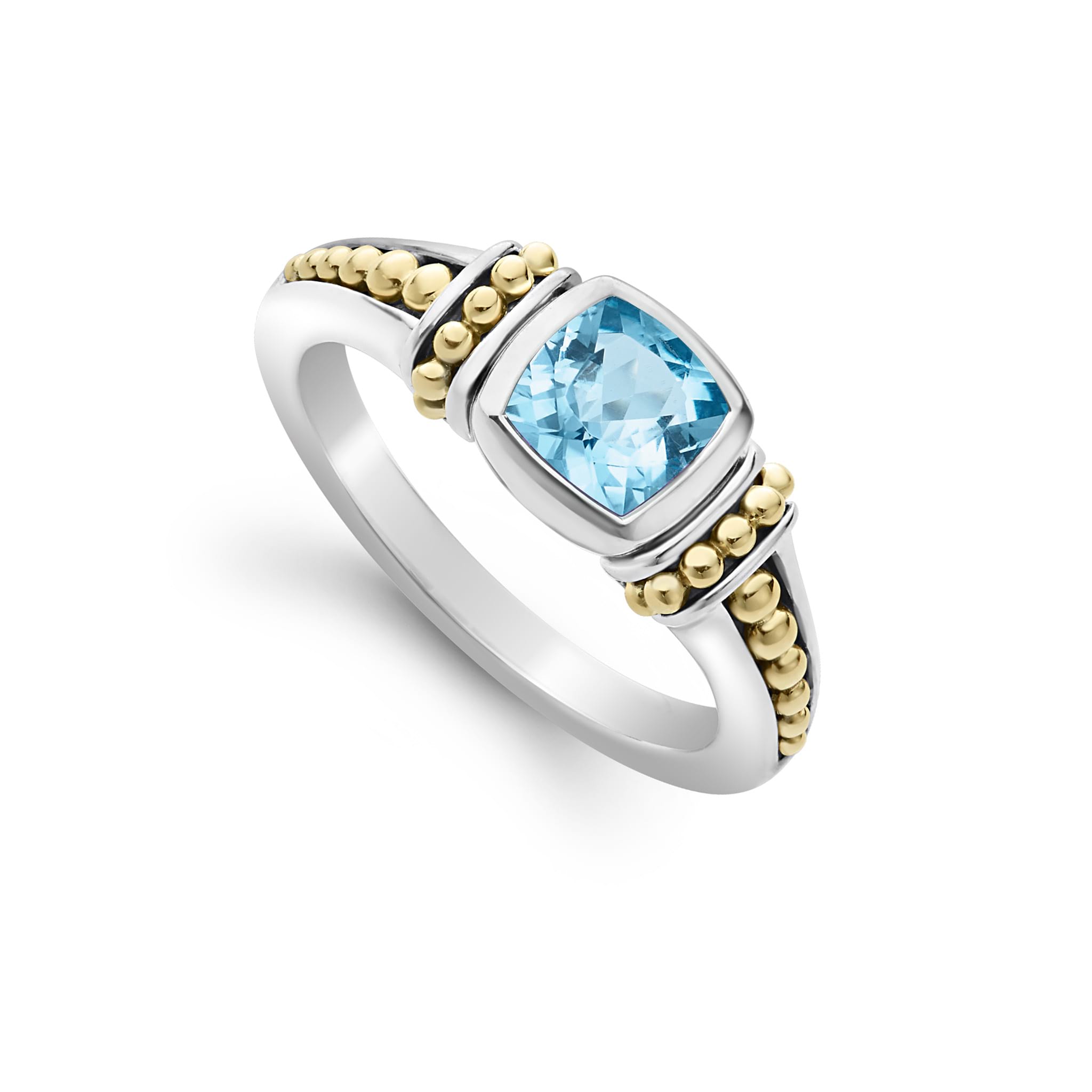 Swiss blue topaz gemstone ring surrounded by sterling silver and 18K gold Caviar beading.