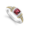 A rhodolite garnet gemstone ring surrounded by sterling silver and 18K gold Caviar beading.