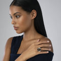 Model displaying the Glacier Large Emerald-Cut Smoky Quartz Ring in sterling silver with 18K gold caviar beading, highlighting its unique smoky quartz gemstone.