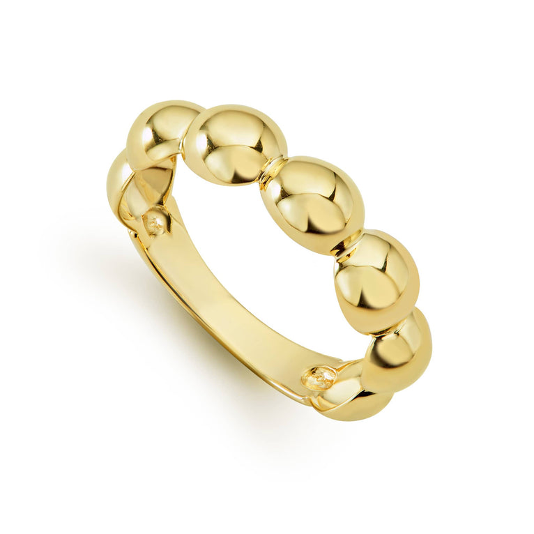 A signature ring with Caviar beading in 18K gold.