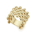 Signature Caviar beading forms this 18K gold statement ring that is comfortable and easy to wear.