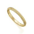 An 18K gold Caviar beaded stacking ring. Perfect to layer with other rings.