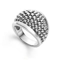 Smooth sterling silver accentuates this domed ring featuring signature Caviar beads.