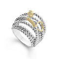 A Caviar statement ring in sterling silver with 18K gold Caviar beading, fluting and a heart detail.